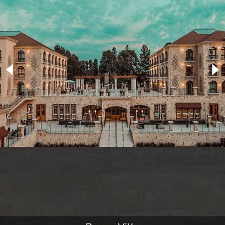 Buona Vitta Gramado Resort & Spa By Gramado Parks Екстер'єр фото The photo shows a spacious and elegant building design, likely a hotel or resort. The structure features multiple stories and large windows, with outdoor seating areas visible on a terrace or patio. The exterior has a combination of stone and modern 